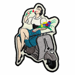 Vespa woman sitting with flowers